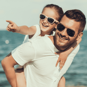 dad and daughter with diabetes protects eyes with sunglasses