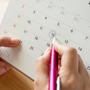 person circles date on calendar for eye doctor appointment