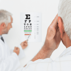 doctor gives patient eye exam to decide if he needs new glasses