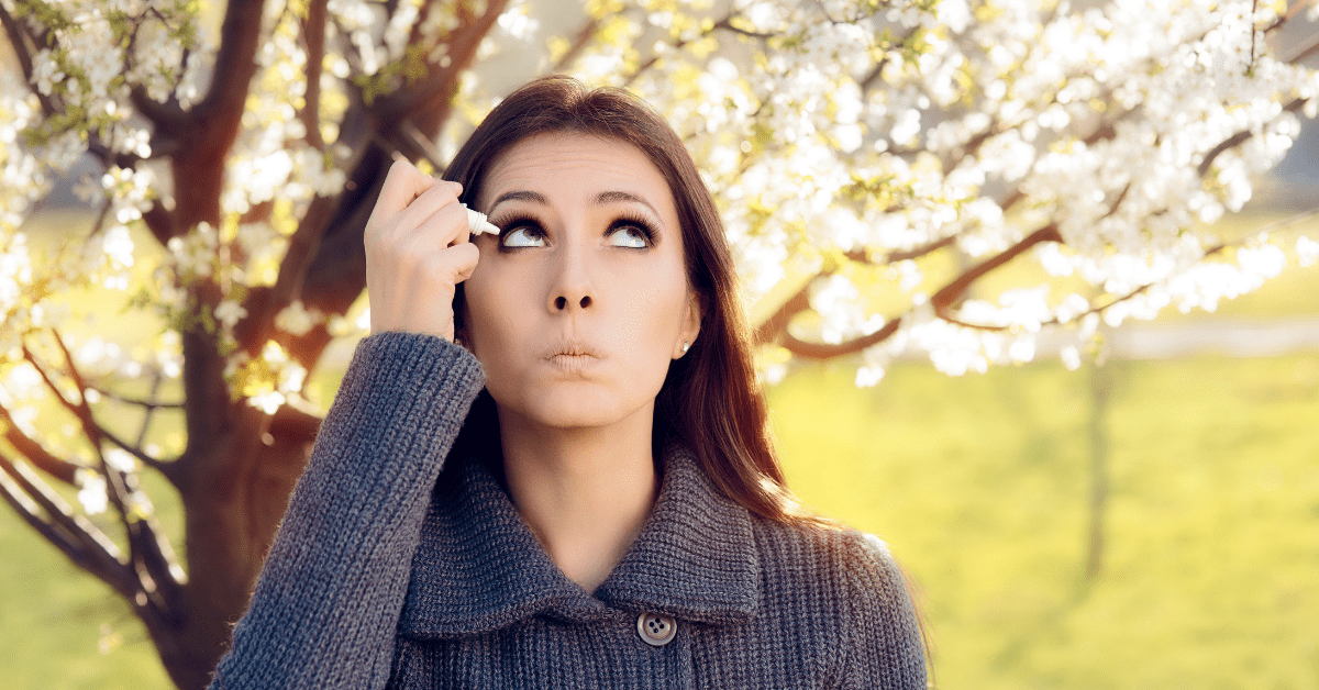 woman uses allergy eye drops
