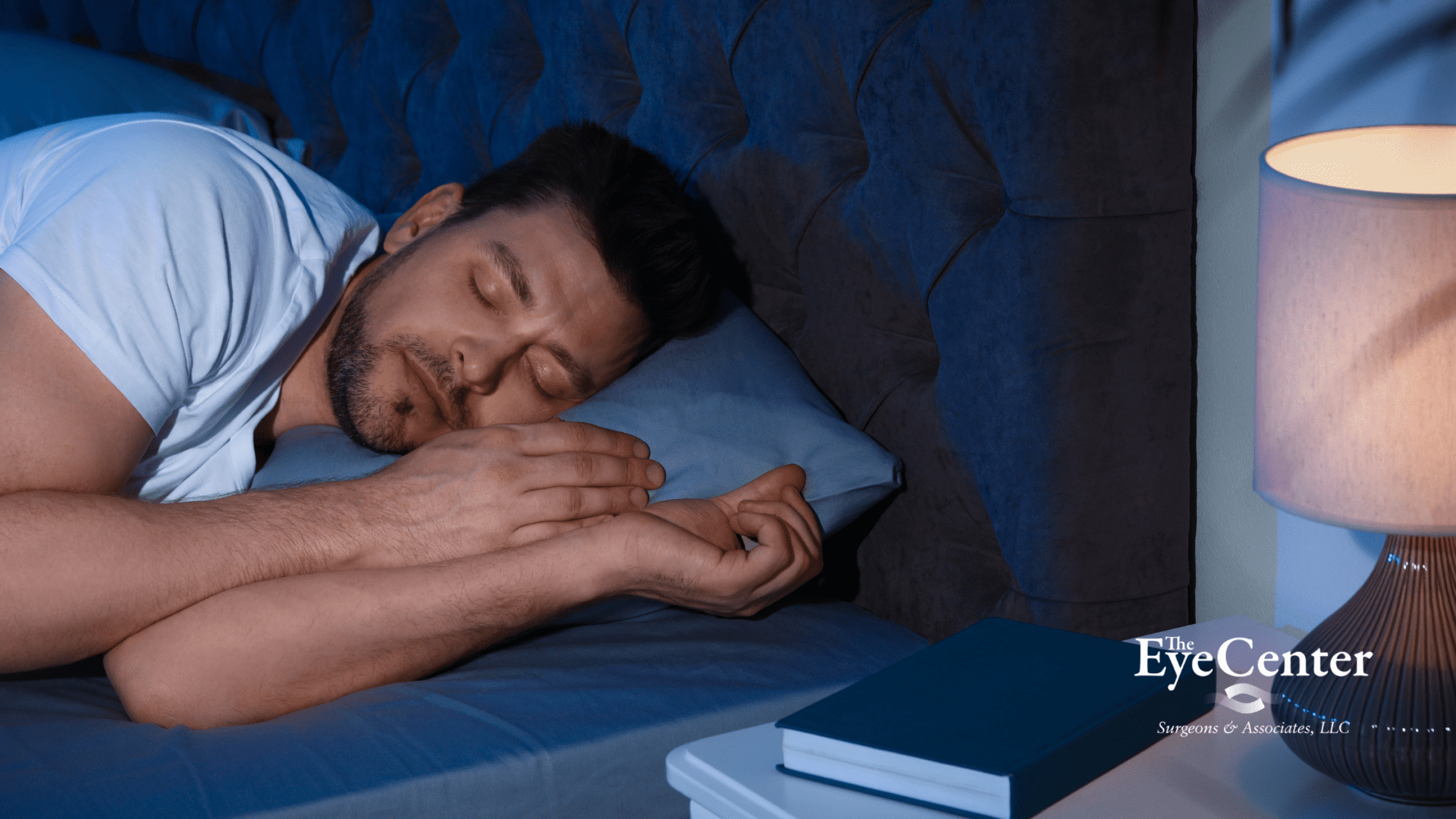 Man sleeping in room with lamp