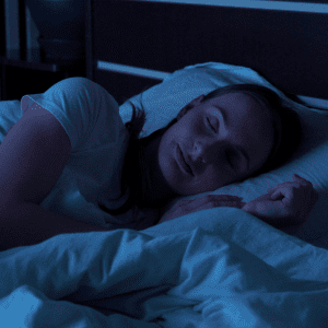 woman sleeping in dark room