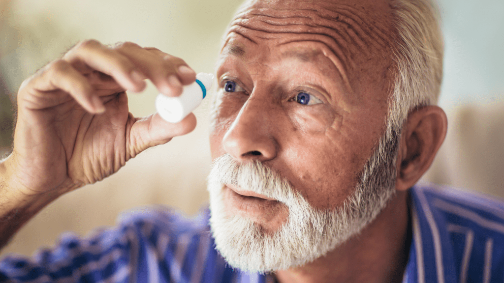 middle aged man using eye drops as treatment options for dry eyes